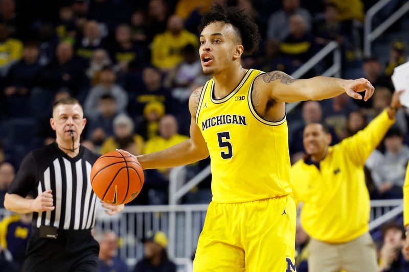 Feb 25, 2024; Ann Arbor, Michigan, USA;  Michigan Wolverines forward Terrance Williams II (5) dribbles in the first half against the Purdue Boilermakers at Crisler Center. Mandatory Credit: Rick Osentoski-USA TODAY Sports