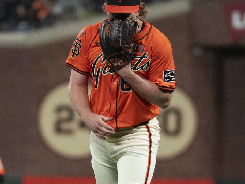 Sep 13, 2024; San Francisco, California, USA;  San Francisco Giants pitcher Logan Webb (62) reacts at the end of the fourth inning against the San Diego Padres at Oracle Park. Mandatory Credit: Stan Szeto-Imagn Images