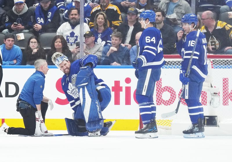 Nov 5, 2024; Toronto, Ontario, CAN; Toronto Maple Leafs goaltender Anthony Stolarz (41) reacts after being hit with a puck against the Boston Bruins during the first period at Scotiabank Arena. Mandatory Credit: Nick Turchiaro-Imagn Imagess