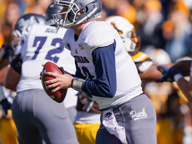 Oct 26, 2019; Laramie, WY, USA; Nevada Wolf Pack quarterback Carson Strong (12) runs against the Wyoming Cowboys during the second quarter at Jonah Field War Memorial Stadium. Mandatory Credit: Troy Babbitt-USA TODAY Sports