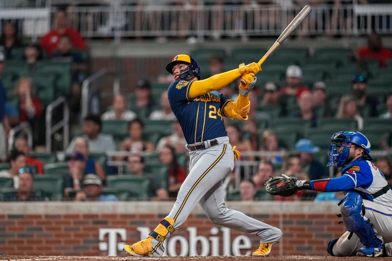 Jul 29, 2023; Cumberland, Georgia, USA; Milwaukee Brewers designated hitter William Contreras (24) hits a home run against the Atlanta Braves during the eighth inning at Truist Park. Mandatory Credit: Dale Zanine-USA TODAY Sports