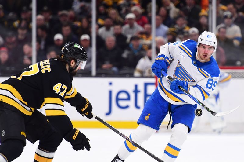 Dec 4, 2025; Boston, Massachusetts, USA; St. Louis Blues left wing Pavel Buchnevich (89) shoots the puck down the ice in front of Boston Bruins center Mark Kastelic (47) during the second period at TD Garden. Mandatory Credit: Bob DeChiara-Imagn Images