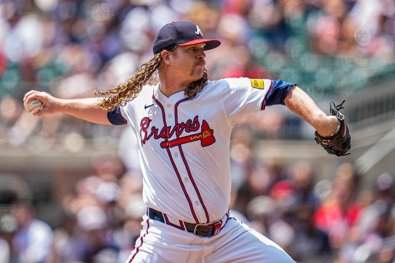 Jul 20, 2025; Cumberland, Georgia, USA; Atlanta Braves starting pitcher Grant Holmes (66) pitches against the New York Yankees during the first inning at Truist Park. Mandatory Credit: Dale Zanine-Imagn Images