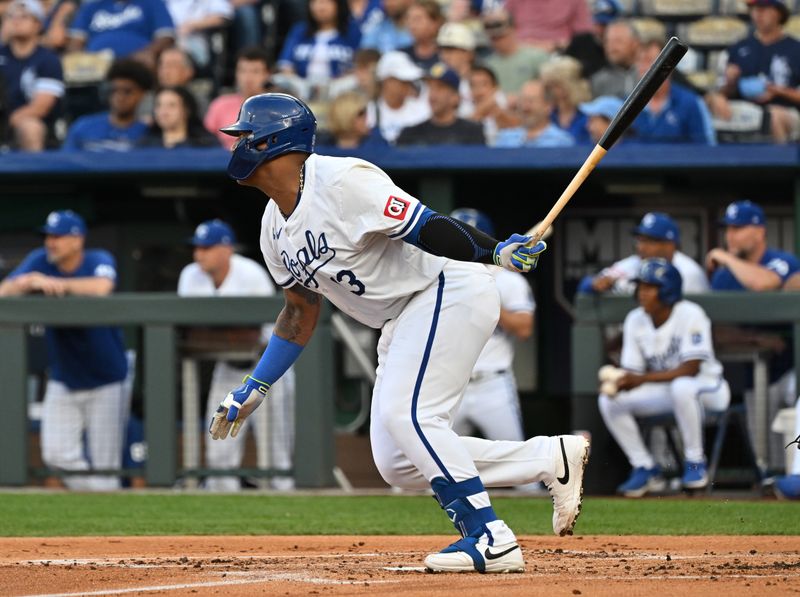 May 21, 2024; Kansas City, Missouri, USA;  Kansas City Royals catcher Salvador Perez (13) hits an RBI single in the first inning against the Detroit Tigers at Kauffman Stadium. Mandatory Credit: Peter Aiken-USA TODAY Sports