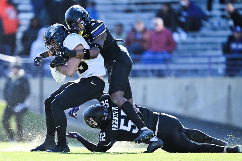 Nov 18, 2023; Evanston, Illinois, USA;  Purdue Boilermakers running back Devin Mockobee (45) is tackled by Northwestern Wildcats defensive back Jaheem Joseph (3) in the fourth quarter at Ryan Field. Mandatory Credit: Jamie Sabau-USA TODAY Sports