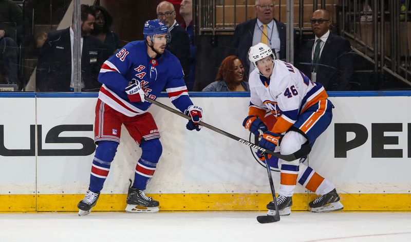 Sep 24, 2024; New York, New York, USA; New York Rangers right wing Reilly Smith (91) and New York Islanders forward Fredrik Karlstrom (46) look for the puck during the second period at Madison Square Garden. Mandatory Credit: Danny Wild-Imagn Images