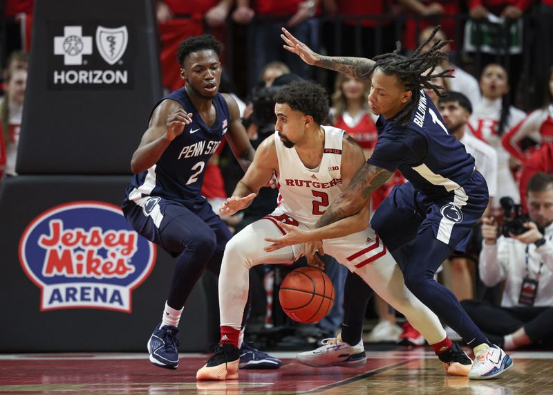 Jan 31, 2024; Piscataway, New Jersey, USA; Penn State Nittany Lions guard Ace Baldwin Jr. (1) steals the ball from Rutgers Scarlet Knights guard Noah Fernandes (2) in front of guard D'Marco Dunn (2)  during the first half at Jersey Mike's Arena. Mandatory Credit: Vincent Carchietta-USA TODAY Sports