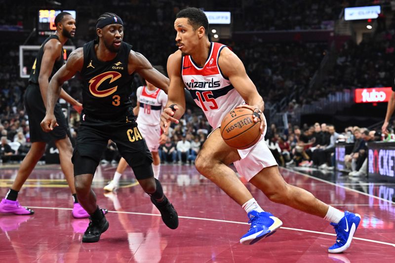 CLEVELAND, OHIO - DECEMBER 03: Caris LeVert #3 of the Cleveland Cavaliers guards Malcolm Brogdon #15 of the Washington Wizards during the first half at Rocket Mortgage Fieldhouse on December 03, 2024 in Cleveland, Ohio. NOTE TO USER: User expressly acknowledges and agrees that, by downloading and or using this photograph, User is consenting to the terms and conditions of the Getty Images License Agreement. (Photo by Jason Miller/Getty Images)