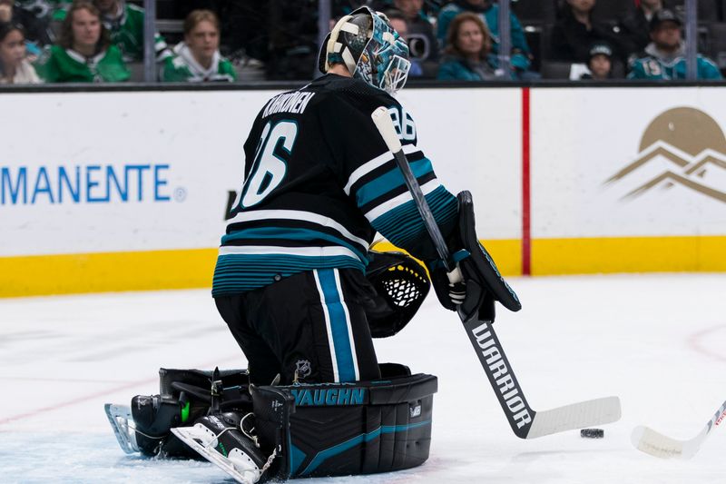 Mar 5, 2024; San Jose, California, USA; San Jose Sharks goaltender Kaapo Kahkonen (36) deflects the puck against the Dallas Stars during the first period at SAP Center at San Jose. Mandatory Credit: John Hefti-USA TODAY Sports