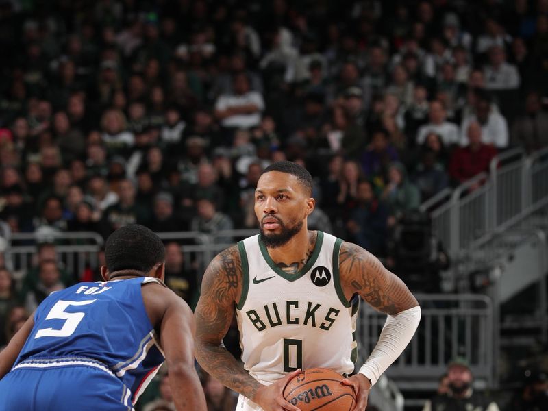 MILWAUKEE, WI - JANUARY 14: Damian Lillard #0 of the Milwaukee Bucks handles the ball during the game against the Sacramento Kings on January 14, 2024 at the Fiserv Forum Center in Milwaukee, Wisconsin. NOTE TO USER: User expressly acknowledges and agrees that, by downloading and or using this Photograph, user is consenting to the terms and conditions of the Getty Images License Agreement. Mandatory Copyright Notice: Copyright 2024 NBAE (Photo by Gary Dineen/NBAE via Getty Images).