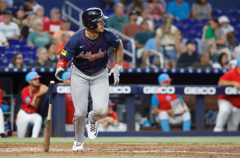 Sep 21, 2024; Miami, Florida, USA;  Atlanta Braves first baseman Matt Olson (28) bats heads to first on his single against the Miami Marlins in the fifth inning at loanDepot Park. Mandatory Credit: Rhona Wise-Imagn Images