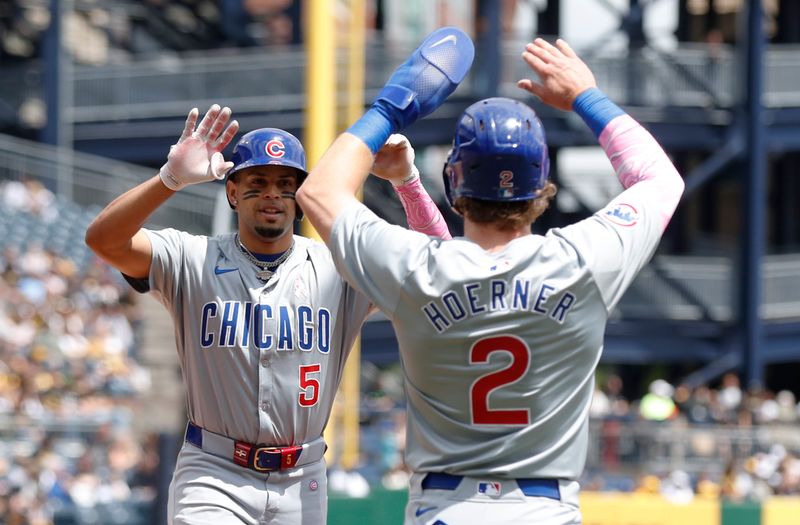 May 12, 2024; Pittsburgh, Pennsylvania, USA;  Chicago Cubs third baseman Christopher Morel (5) celebrates his two run home run with shortstop Nico Hoerner (2) against the Pittsburgh Pirates during the first inning at PNC Park. Mandatory Credit: Charles LeClaire-USA TODAY Sports