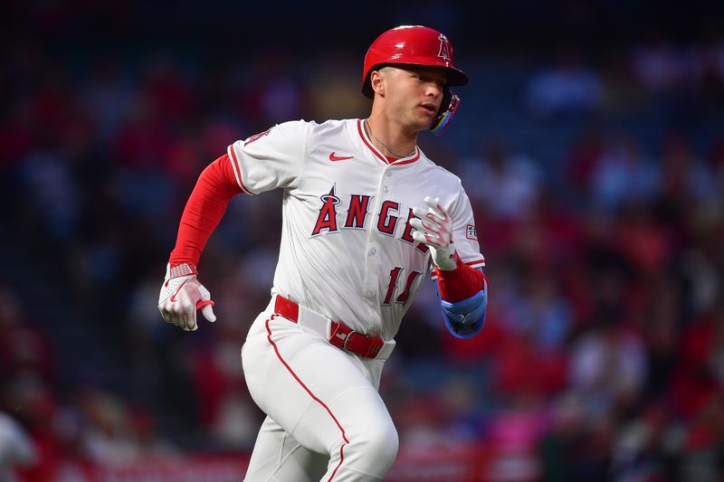 May 1, 2025; Anaheim, California, USA; Los Angeles Angels designated hitter Logan O'Hoppe (14) runs after hitting a single against the Detroit Tigers during the fourth inning at Angel Stadium. Mandatory Credit: Gary A. Vasquez-Imagn Images