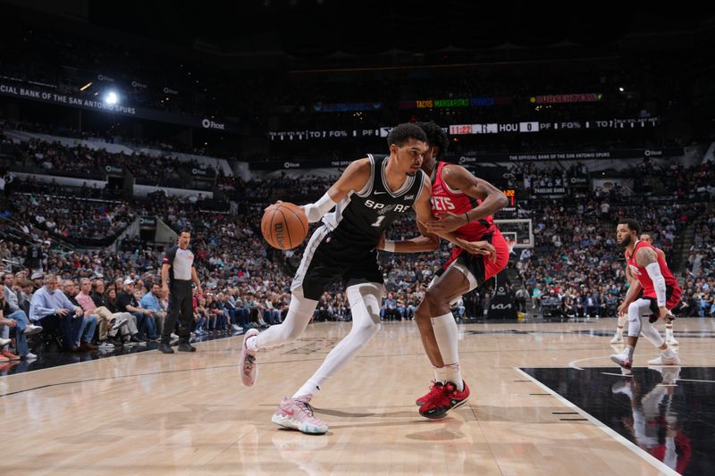 SAN ANTONIO, TX - MARCH 12: Victor Wembanyama #1 of the San Antonio Spurs dribbles the ball during the game against the Houston Rockets on March 12, 2024 at the Frost Bank Center in San Antonio, Texas. NOTE TO USER: User expressly acknowledges and agrees that, by downloading and or using this photograph, user is consenting to the terms and conditions of the Getty Images License Agreement. Mandatory Copyright Notice: Copyright 2024 NBAE (Photos by Jesse D. Garrabrant/NBAE via Getty Images)