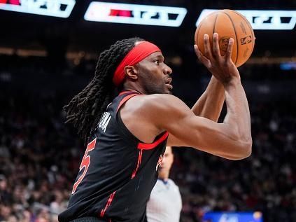 TORONTO, ON - DECEMBER 23: Precious Achiuwa #5 of the Toronto Raptors shoots against the Utah Jazz during the first half of their basketball game at the Scotiabank Arena on December 23, 2023 in Toronto, Ontario, Canada. NOTE TO USER: User expressly acknowledges and agrees that, by downloading and/or using this Photograph, user is consenting to the terms and conditions of the Getty Images License Agreement. (Photo by Mark Blinch/Getty Images)