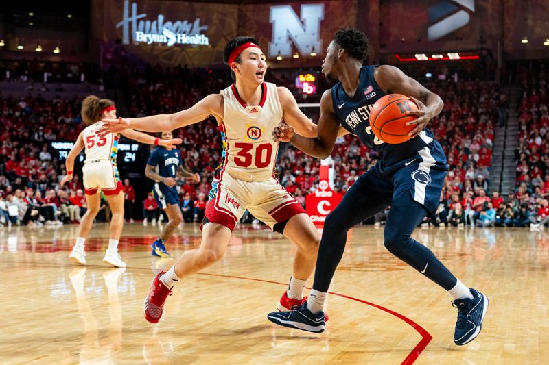 Feb 17, 2024; Lincoln, Nebraska, USA; Penn State Nittany Lions guard D'Marco Dunn (2) drives against Nebraska Cornhuskers guard Keisei Tominaga (30) during the second half at Pinnacle Bank Arena. Mandatory Credit: Dylan Widger-USA TODAY Sports