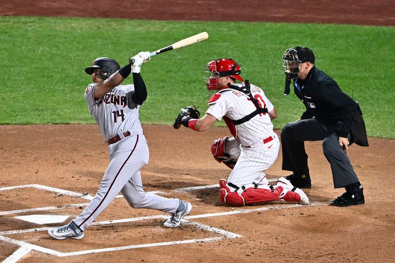 Oct 24, 2023; Philadelphia, Pennsylvania, USA; Arizona Diamondbacks catcher Gabriel Moreno (14) hits a single against the Philadelphia Phillies in the first inning during game seven of the NLCS for the 2023 MLB playoffs at Citizens Bank Park. Mandatory Credit: Kyle Ross-USA TODAY Sports