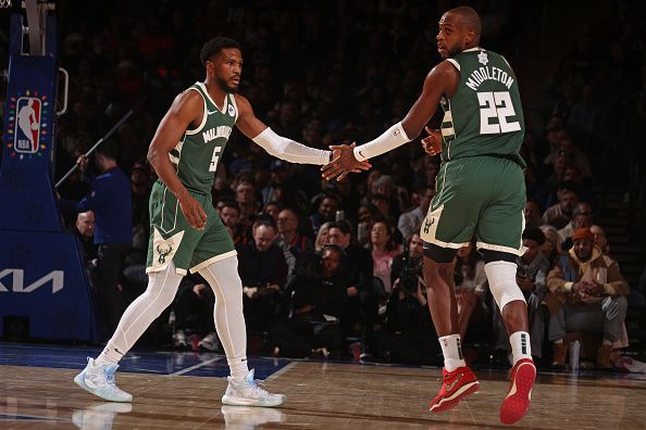 NEW YORK, NY - DECEMBER 25: Khris Middleton #22 and Malik Beasley #5 of the Milwaukee Bucks high five during the game against the New York Knicks on December 25, 2023 at Madison Square Garden in New York City, New York.  NOTE TO USER: User expressly acknowledges and agrees that, by downloading and or using this photograph, User is consenting to the terms and conditions of the Getty Images License Agreement. Mandatory Copyright Notice: Copyright 2023 NBAE  (Photo by Nathaniel S. Butler/NBAE via Getty Images)