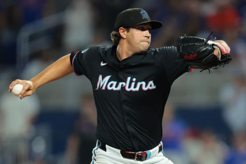 Sep 26, 2025; Miami, Florida, USA; Miami Marlins relief pitcher Tyler Phillips (30) delivers a pitch against the New York Mets during the ninth inning at loanDepot Park. Mandatory Credit: Sam Navarro-Imagn Images