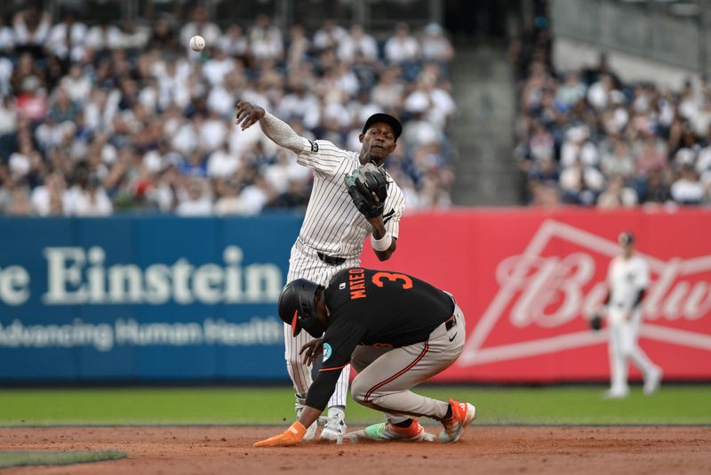 Sep 28, 2025; Bronx, New York, USA; New York Yankees second baseman Jazz Chisholm Jr. (13) forces out Baltimore Orioles shortstop Jorge Mateo (3) but is unable to complete the double play during the ninth inning at Yankee Stadium. Mandatory Credit: John Jones-Imagn Images