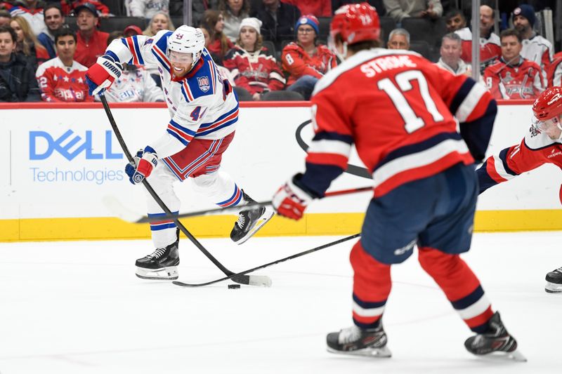 Dec 31, 2025; Washington, District of Columbia, USA; New York Rangers defenseman Vladislav Gavrikov (44) shoots the puck against the Washington Capitals during the second period at Capital One Arena. Mandatory Credit: Hannah Foslien-Imagn Images