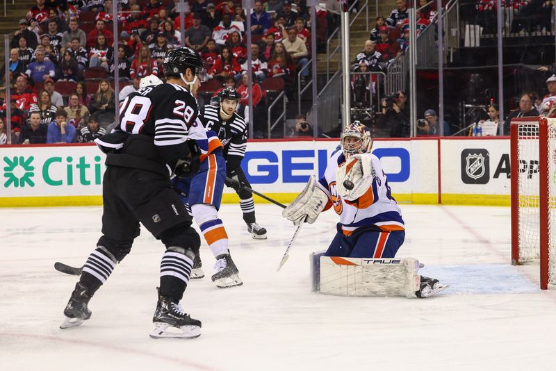 Apr 15, 2024; Newark, New Jersey, USA; New York Islanders goaltender Semyon Varlamov (40) makes a save against the New Jersey Devils during the second period at Prudential Center. Mandatory Credit: Ed Mulholland-USA TODAY Sports