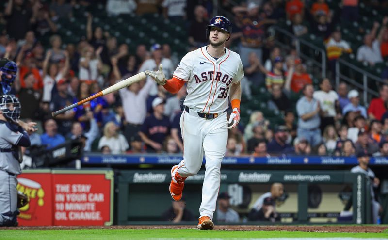 May 1, 2024; Houston, Texas, USA;  Houston Astros right fielder Kyle Tucker (30) tosses his bat after hitting a home run during the seventh inning against the Cleveland Guardians at Minute Maid Park. Mandatory Credit: Troy Taormina-USA TODAY Sports