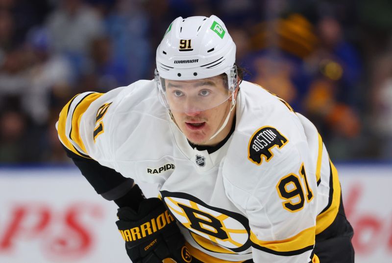 Mar 25, 2026; Buffalo, New York, USA;  Boston Bruins defenseman Nikita Zadorov (91) waits for the face-off during the first period against the Buffalo Sabres at KeyBank Center. Mandatory Credit: Timothy T. Ludwig-Imagn Images