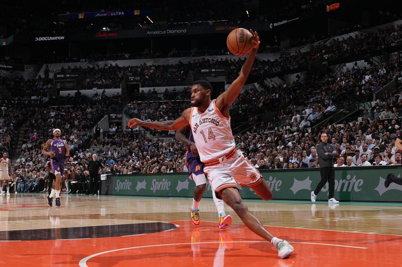 SAN ANTONIO, TX - MARCH 25: Blake Wesley #14 of the San Antonio Spurs dribbles the ball during the game against the Phoenix Suns on March 25, 2024 at the AT&T Center in San Antonio, Texas. NOTE TO USER: User expressly acknowledges and agrees that, by downloading and or using this photograph, user is consenting to the terms and conditions of the Getty Images License Agreement. Mandatory Copyright Notice: Copyright 2024 NBAE (Photos by Jesse D. Garrabrant/NBAE via Getty Images)