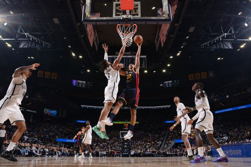 SAN FRANCISCO, CA - NOVEMBER 25: Trayce Jackson-Davis #32 of the Golden State Warriors drives to the basket during the game against the Brooklyn Nets on November 25, 2024 at Chase Center in San Francisco, California. NOTE TO USER: User expressly acknowledges and agrees that, by downloading and or using this photograph, user is consenting to the terms and conditions of Getty Images License Agreement. Mandatory Copyright Notice: Copyright 2024 NBAE (Photo by Noah Graham/NBAE via Getty Images)