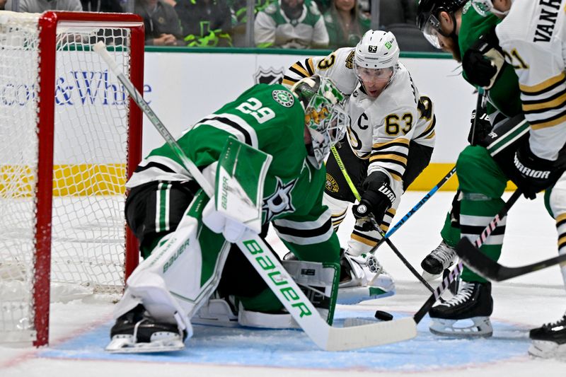 Nov 6, 2023; Dallas, Texas, USA; Dallas Stars goaltender Jake Oettinger (29) covers up the puck n front of Boston Bruins left wing Brad Marchand (63) during the first period at the American Airlines Center. Mandatory Credit: Jerome Miron-USA TODAY Sports