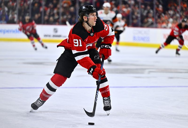 Apr 13, 2024; Philadelphia, Pennsylvania, USA; New Jersey Devils center Dawson Mercer (91) controls the puck against the Philadelphia Flyers in the second period at Wells Fargo Center. Mandatory Credit: Kyle Ross-USA TODAY Sports