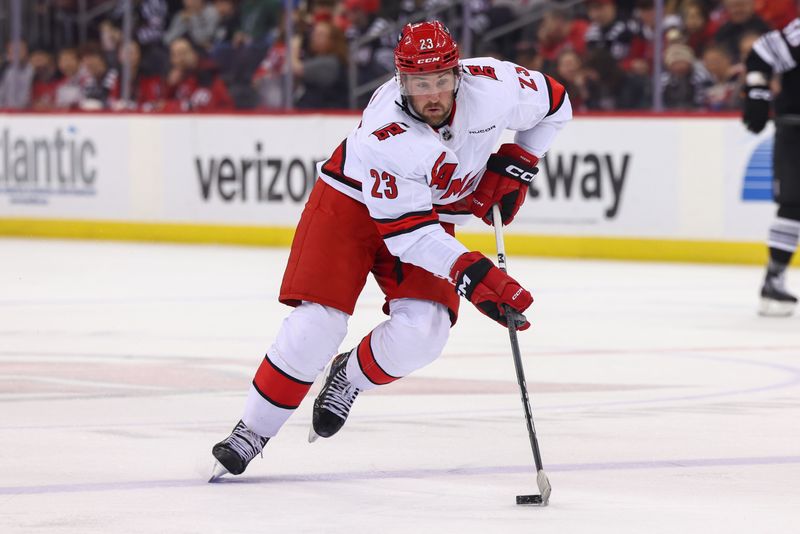 Mar 9, 2024; Newark, New Jersey, USA; Carolina Hurricanes right wing Stefan Noesen (23) skates with the puck against the New Jersey Devils during the first period at Prudential Center. Mandatory Credit: Ed Mulholland-USA TODAY Sports