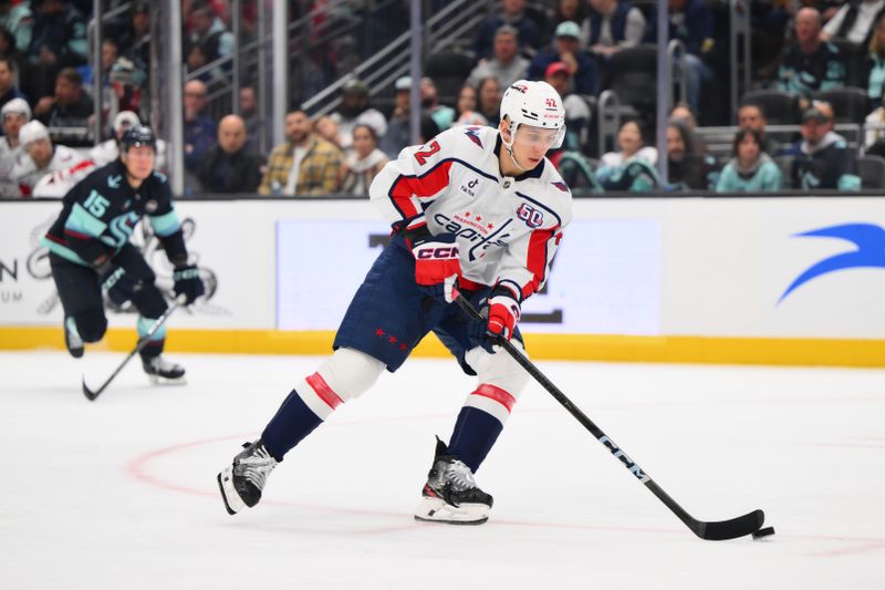 Jan 23, 2025; Seattle, Washington, USA; Washington Capitals defenseman Martin Fehervary (42) plays the puck during the first period against the Seattle Kraken at Climate Pledge Arena. Mandatory Credit: Steven Bisig-Imagn Images