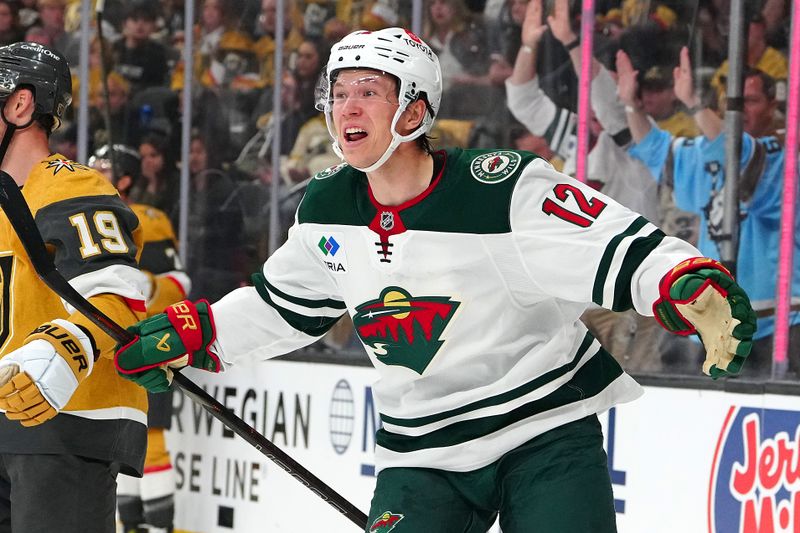 Apr 20, 2025; Las Vegas, Nevada, USA; Minnesota Wild left wing Matt Boldy (12) celebrates after scoring a goal against the Vegas Golden Knights during the first period of game one of the first round of the 2025 Stanley Cup Playoffs at T-Mobile Arena. Mandatory Credit: Stephen R. Sylvanie-Imagn Images