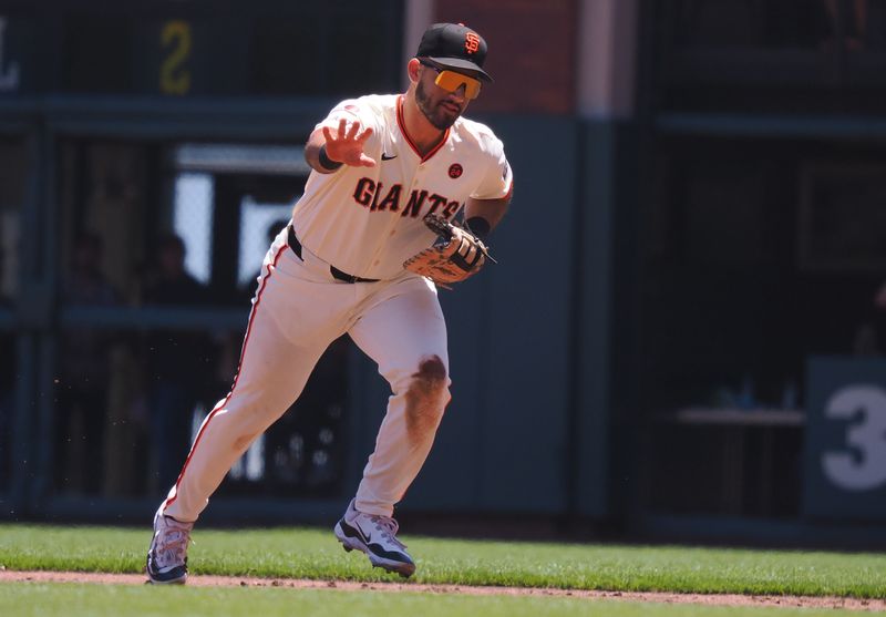 Jun 30, 2024; San Francisco, California, USA; San Francisco Giants first baseman David Villar (32) gestures as he goes to tag first base for an out against the Los Angeles Dodgers during the first inning at Oracle Park. Mandatory Credit: Kelley L Cox-USA TODAY Sports