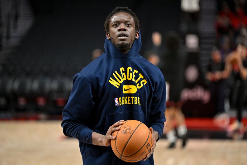 PORTLAND, OREGON - MARCH 23: Reggie Jackson #7 of the Denver Nuggets warms up before the game against the Portland Trail Blazers at the Moda Center on March 23, 2024 in Portland, Oregon. NOTE TO USER: User expressly acknowledges and agrees that, by downloading and or using this photograph, User is consenting to the terms and conditions of the Getty Images License Agreement. (Photo by Alika Jenner/Getty Images)