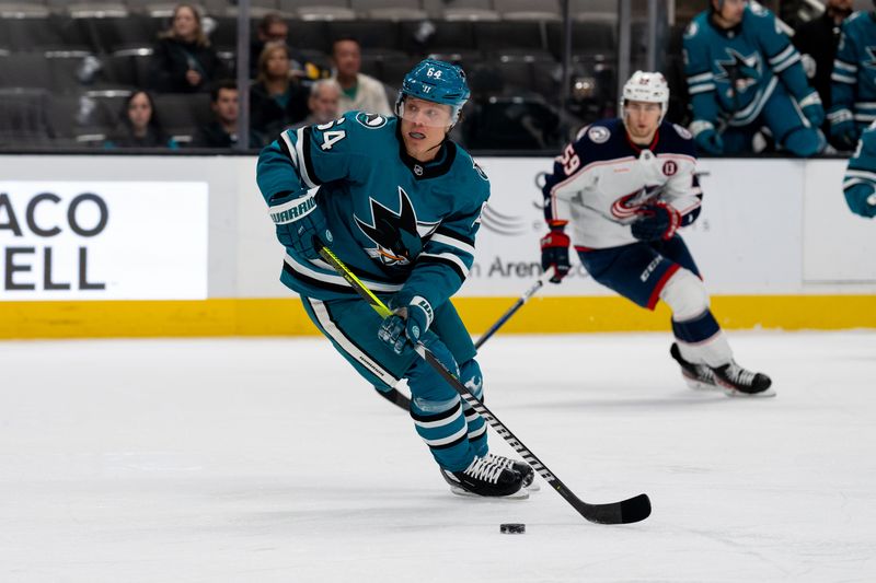 Nov 5, 2024; San Jose, California, USA;  San Jose Sharks center Mikael Granlund (64) controls the puck against against the Columbus Blue Jackets during the first period at SAP Center at San Jose. Mandatory Credit: Neville E. Guard-Imagn Images