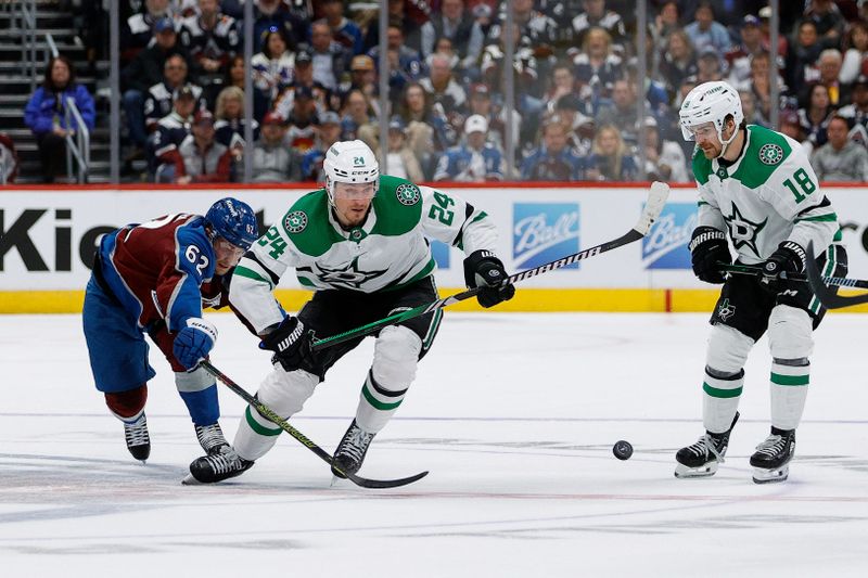 May 11, 2024; Denver, Colorado, USA; Colorado Avalanche left wing Artturi Lehkonen (62) and Dallas Stars center Roope Hintz (24) battle for the puck ahead of center Sam Steel (18) in the third period in game three of the second round of the 2024 Stanley Cup Playoffs at Ball Arena. Mandatory Credit: Isaiah J. Downing-USA TODAY Sports