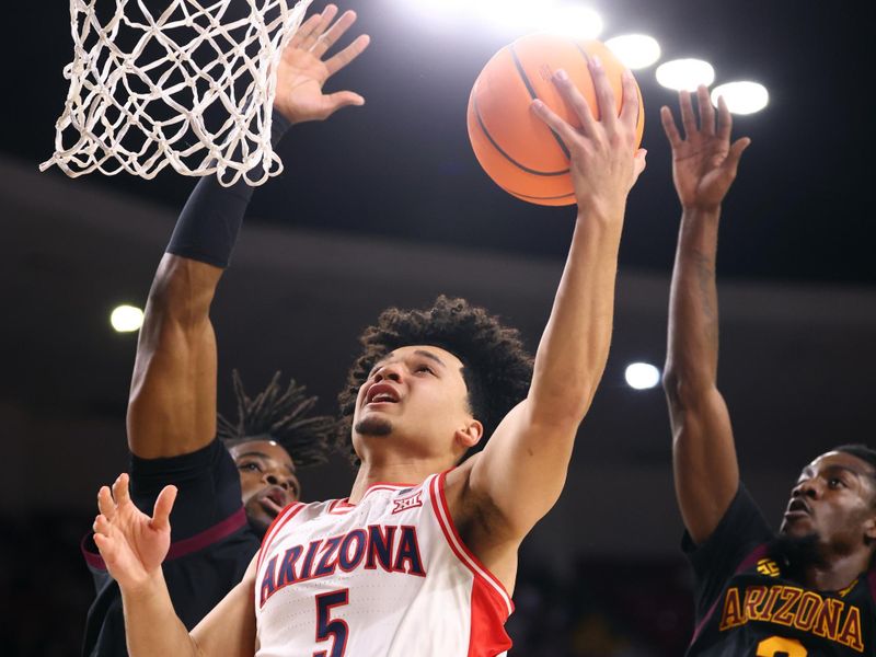 Jan 31, 2026; Tempe, Arizona, USA; Arizona Wildcats guard Brayden Burries (5) against the Arizona State Sun Devils in the first half at Desert Financial Arena. Mandatory Credit: Mark J. Rebilas-Imagn Images