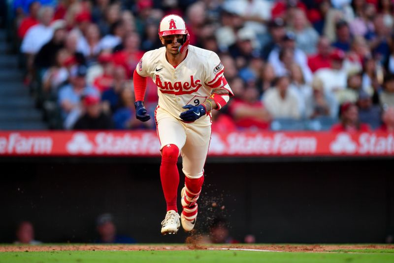 May 27, 2025; Anaheim, California, USA; Los Angeles Angels shortstop Zach Neto (9) runs after hitting a single against the New York Yankees during the third inning at Angel Stadium. Mandatory Credit: Gary A. Vasquez-Imagn Images
