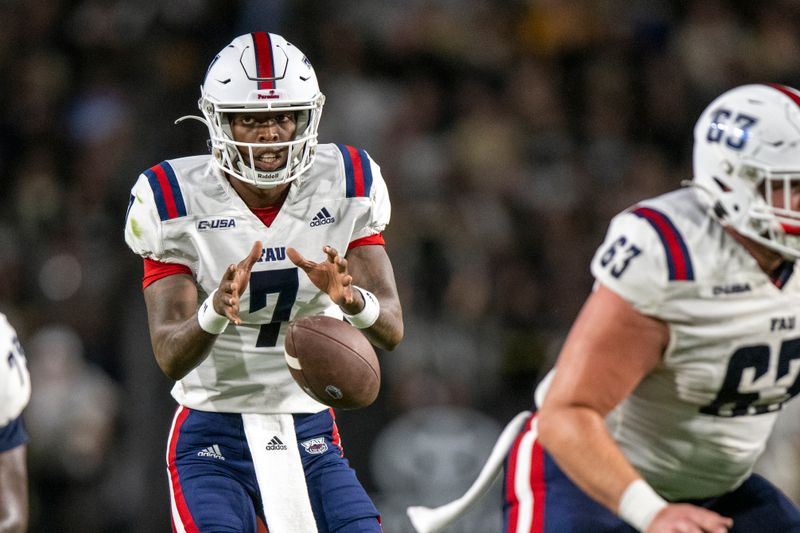 Sep 24, 2022; West Lafayette, Indiana, USA; Florida Atlantic Owls quarterback N'Kosi Perry (7) takes a snap during the second quarter against the Purdue Boilermakers at Ross-Ade Stadium. Mandatory Credit: Marc Lebryk-USA TODAY Sports