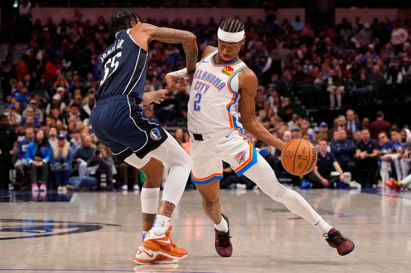 DALLAS, TEXAS - FEBRUARY 10: Shai Gilgeous-Alexander #2 of the Oklahoma City Thunder is defended by Derrick Jones Jr. #55 of the Dallas Mavericks during the first half at American Airlines Center on February 10, 2024 in Dallas, Texas. NOTE TO USER: User expressly acknowledges and agrees that, by downloading and or using this photograph, User is consenting to the terms and conditions of the Getty Images License Agreement. (Photo by Sam Hodde/Getty Images)