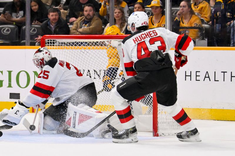 Mar 26, 2026; Nashville, Tennessee, USA; New Jersey Devils goaltender Jacob Markstrom (25) blocks the shot of Nashville Predators center Steven Stamkos (91) from behind the net during the first period at Bridgestone Arena. Mandatory Credit: Steve Roberts-Imagn Images Mar 26, 2026; Nashville, Tennessee, USA; New Jersey Devils goaltender Jacob Markstrom (25) blocks the shot of Nashville Predators center Steven Stamkos (91) from behind the net during the first period at Bridgestone Arena. Mandatory Credit: Steve Roberts-Imagn Images