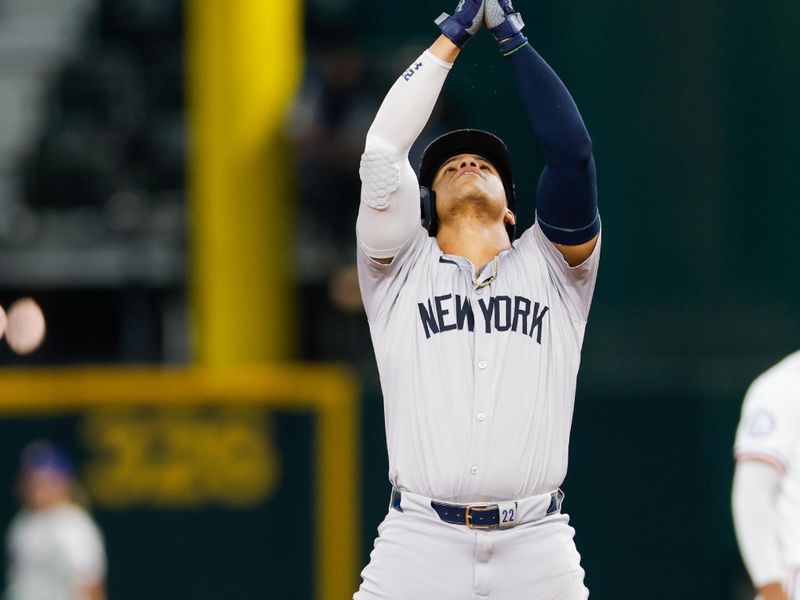Sep 4, 2024; Arlington, Texas, USA; New York Yankees outfielder Juan Soto (22) hits a double during the first inning against the Texas Rangers at Globe Life Field. Mandatory Credit: Andrew Dieb-Imagn Images