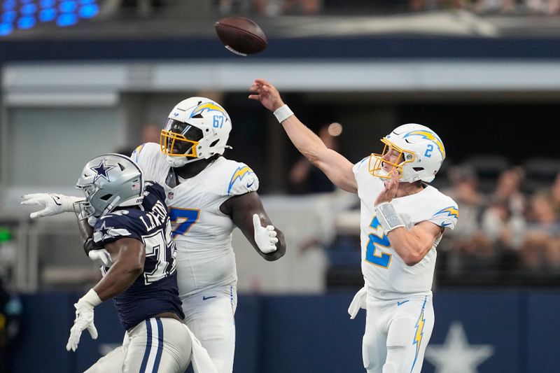 Los Angeles Chargers quarterback Easton Stick (2) throws a pass during the first half of a preseason NFL football game against the Dallas Cowboys, Saturday, Aug. 24, 2024, in Arlington, Texas.(AP Photo/Tony Gutierrez )