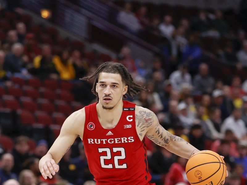 Mar 9, 2023; Chicago, IL, USA; Rutgers Scarlet Knights guard Caleb McConnell (22) dribbles against the Michigan Wolverines during the first half at United Center. Mandatory Credit: Kamil Krzaczynski-USA TODAY Sports