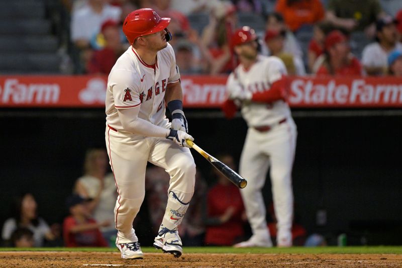 Jun 28, 2025; Anaheim, California, USA;  Los Angeles Angels right fielder Mike Trout (27) hits a solo home run in the seventh inning against the Washington Nationals at Angel Stadium. Mandatory Credit: Jayne Kamin-Oncea-Imagn Images