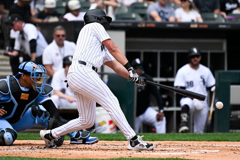Jun 7, 2025; Chicago, Illinois, USA;  Chicago White Sox second baseman Josh Rojas (5) doubles during the second inning against the Kansas City Royals at Rate Field. Mandatory Credit: Matt Marton-Imagn Images