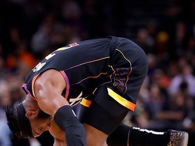 PHOENIX, ARIZONA - JANUARY 01: Josh Okogie #2 of the Phoenix Suns battles for a loose ball during the first half against the Portland Trail Blazers at Footprint Center on January 01, 2024 in Phoenix, Arizona. NOTE TO USER: User expressly acknowledges and agrees that, by downloading and or using this photograph, User is consenting to the terms and conditions of the Getty Images License Agreement.  (Photo by Chris Coduto/Getty Images)